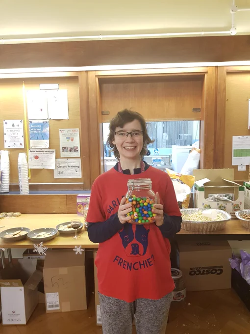 Clare with a jar of M&M's
