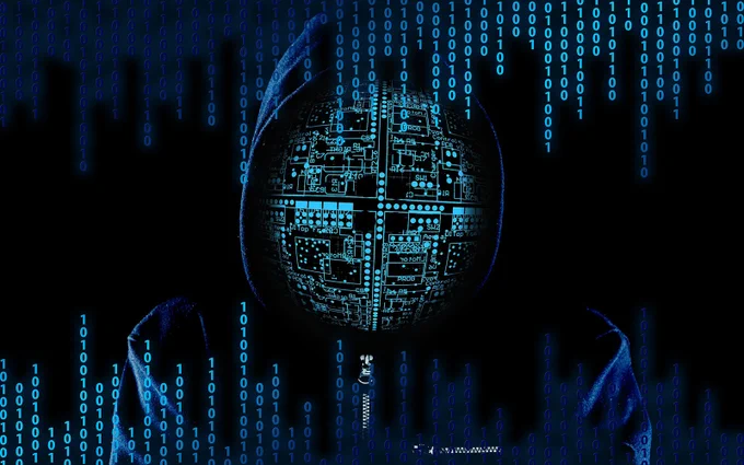 hooded figure with a computer screen for a face surrounded by binary code