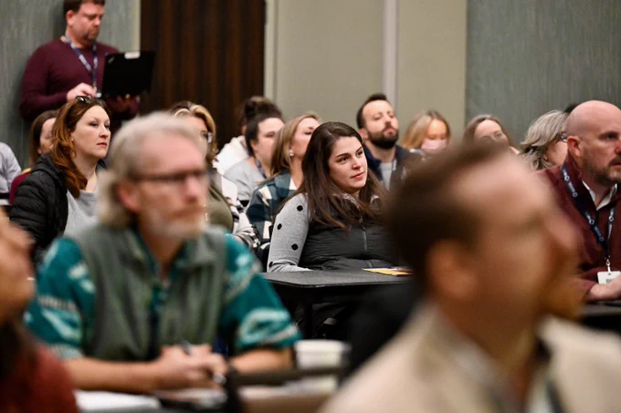 Breakout session attendees listening to presentation speakers