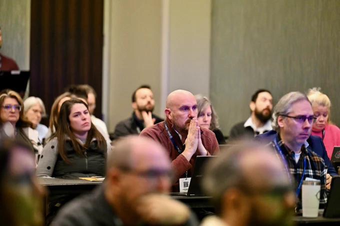 Breakout session attendees listening to presentation speakers