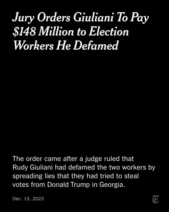 A card reads: "Jury Orders Giuliani To Pay $148 Million to Election Workers He Defamed. The order came after a judge ruled that  Rudy Giuliani had defamed the two workers by spreading lies that they had tried to steal votes from Donald Trump in Georgia."