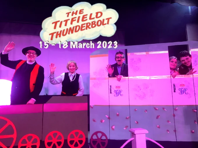 The cast of The Titfield Thunderbolt wave from their stage-train.