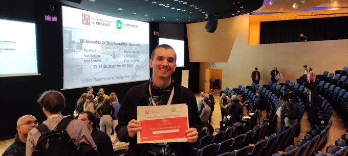 Person holding a diploma in conference hall
