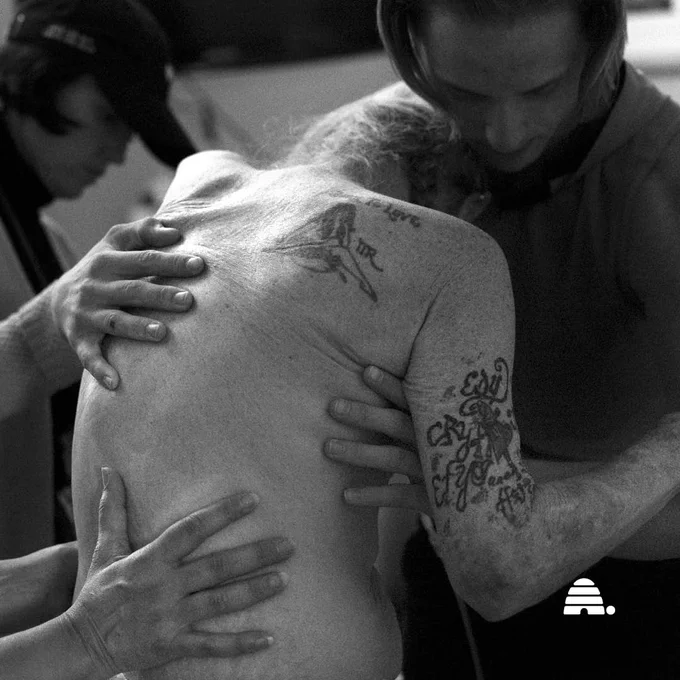 Paul Youngblood is helped back into bed with the help of his grandson, Sylys Dye, right, volunteer Amy Leininger and a death doula at The INN Between in Salt Lake City on Sunday, Aug. 6, 2023. | By Laura Seitz, Deseret News