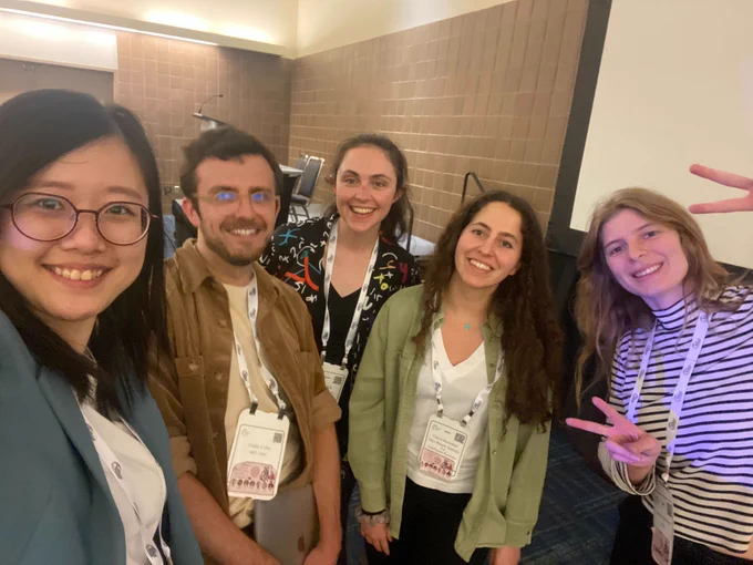 A photo of 5 happy people