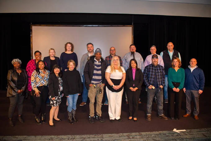 OGS Commissioner Jeanette Moy stands with #TeamOGS members at the 2023 Years of Service Awards Ceremony.