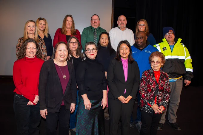OGS Commissioner Jeanette Moy stands with #TeamOGS members at the 2023 Years of Service Awards Ceremony.