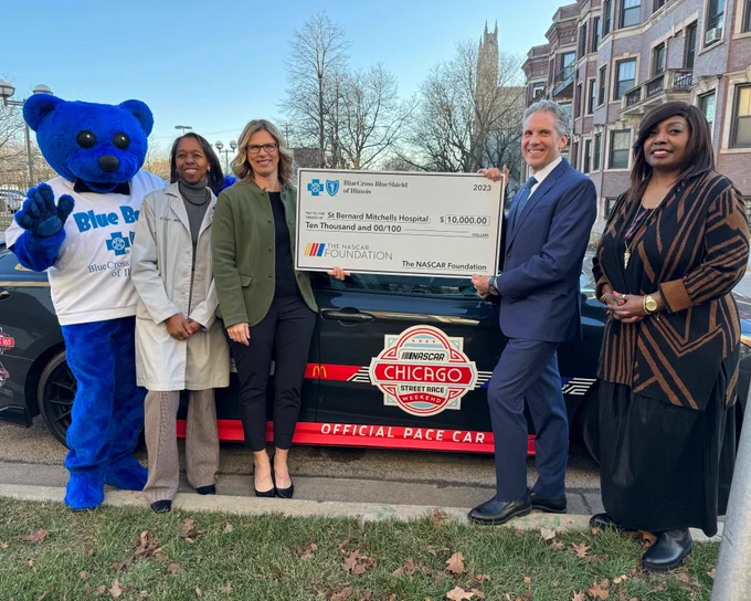 NASCAR Chicago and Blue Cross and Blue Shield of Illinois presenting a big check to St Bernard Mitchells Hospital.
