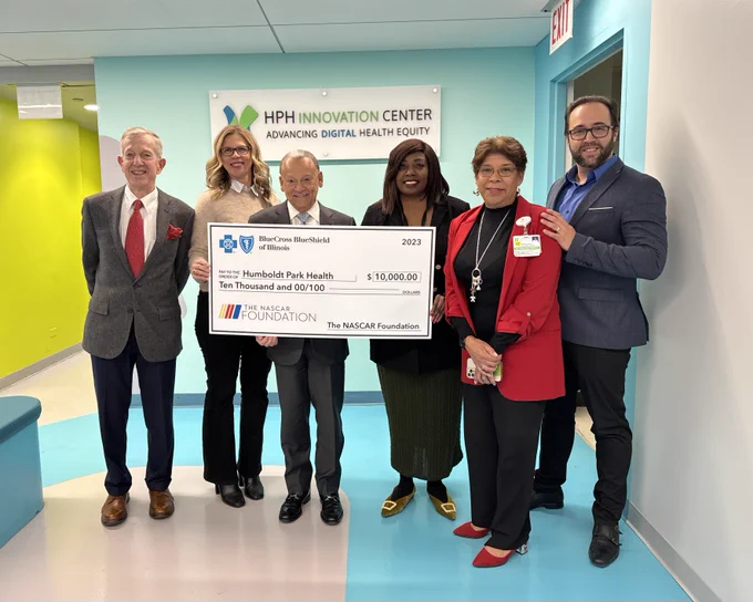 NASCAR Chicago and Blue Cross and Blue Shield of Illinois presenting a big check to Humboldt Park Health.