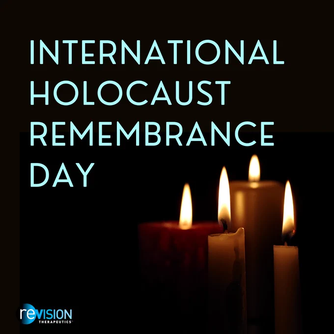 On a black background, there are four lit candles to the right. The text says, “International Holocaust Remembrance Day” in light blue.