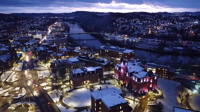A snowy scene of Downtown Campus at WVU in Morgantown, WV, taken from a drone.