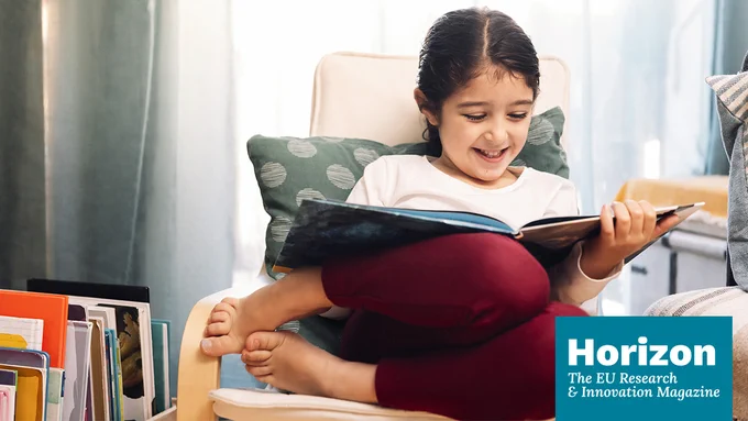 Happy girl reading a book and the Horizon Magazine logo displayed at the bottom.