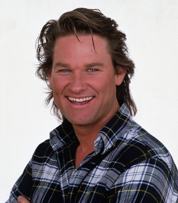  kurt russell in a blue flannel shirt. shoulder length dirty blonde hair. grinning.

"when some wild-eyed, eight-foot-tall maniac grabs your neck, taps the back of your favorite head up against the barroom wall, and he looks you crooked in the eye and he asks you if ya paid your dues, you just stare that big sucker right back in the eye, and you remember what ol' jack burton always says at a time like that: "have ya paid your dues, Jack?" "yes, sir, the check is in the mail."
