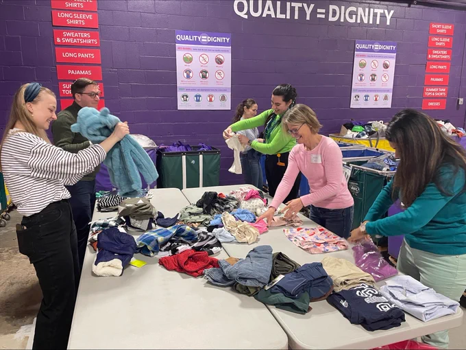 EEC team, Massachusetts Head Start Association and the Alliance of Massachusetts YMCAs sorting donated clothes