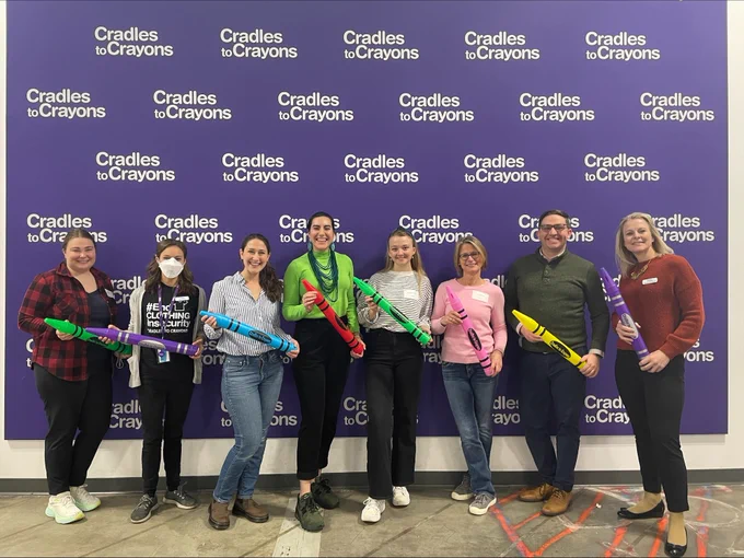 EEC team, Massachusetts Head Start Association and the Alliance of Massachusetts YMCAs posing for a photo with Cradles to Crayons