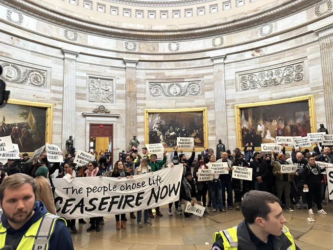 Photo of a crowd of 80 org leaders in the Capitol rotunda holding a banner that says CeasefireNow the people choose life