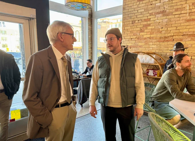 Gov. Evers talks to a small business owner.