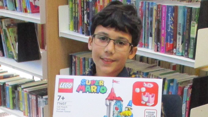 child with lego kit