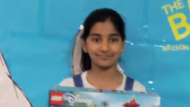 child with lego kit
