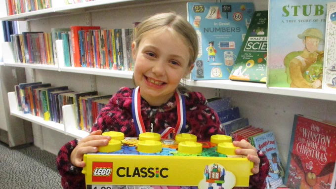 child with lego kit