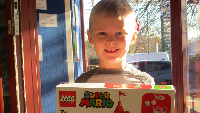 child with lego kit