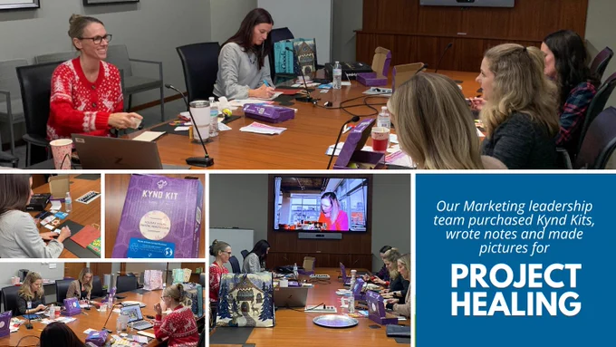 Marketing leadership team writing notes and coloring pictures at a large conference table