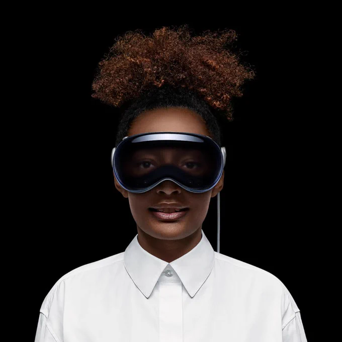 Picture of a woman wearing a Apple Vision Pro headset