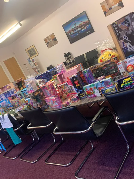 A wide photo of childrens toys laid across a table