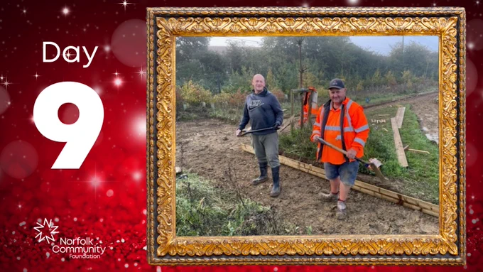 Picture frame on a festive background. The framed picture is of two men with shovels digging the ground in a community garden. Text beside image reads: Day 9