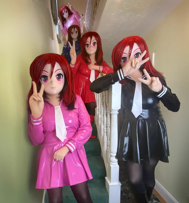 5 Kara Kigs composited into a single picture on the stairs, each wearing a different colour PVC Seifuku throwing the peace sign