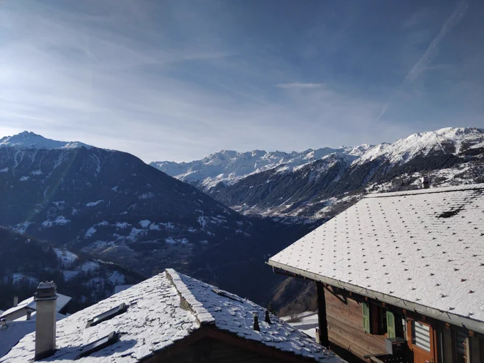 Snowy mountain view from a Swiss chalet
