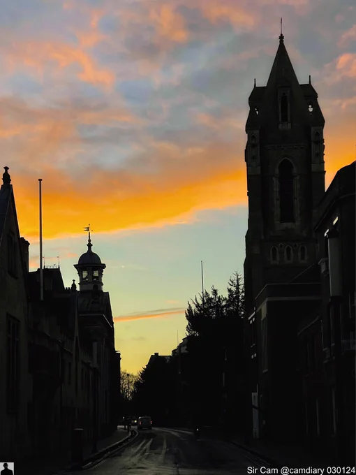 Sunrise in Cambridge, 3 January. Pembroke College silhouetted against the orange of the sunrise sky. Wren Chapel on the left and the tower of the former United Reformed Church on the right.