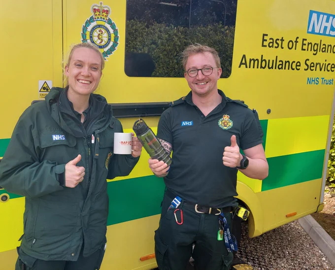 Two of our RAPID2 paramedics standing in front of an ambulance