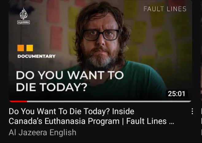 screenshot from youtube video: Do You Want To Die Today? Inside Canada's Euthanasia Program. link above. @odspoor is seen with stocky notes on the wall behind him.