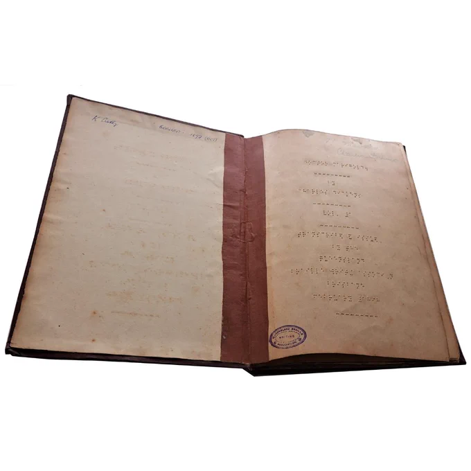 A colour photograph of a book written in braille. 