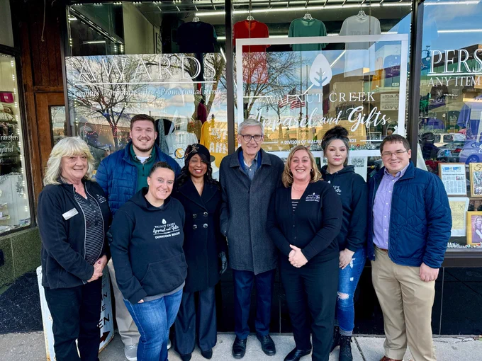 Gov. Evers, Sen. Spreitzer, Rep. Anderson, and small business owners in front of Walnut Creek Apparel and Gifts in Beloit.