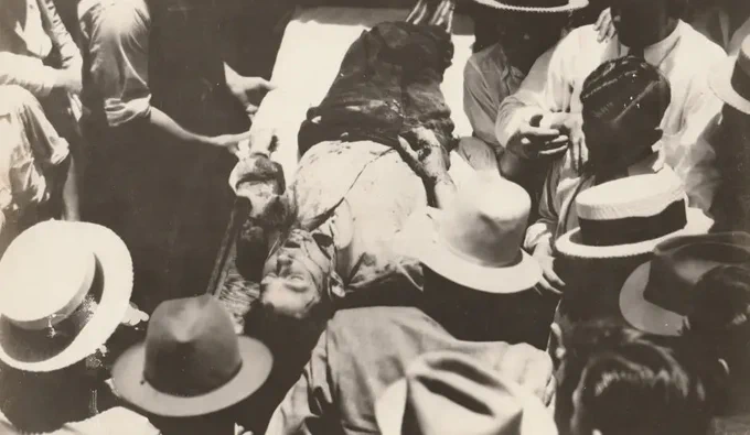 Crowds clamour around the notorious pair's bullet-riddled car in LouisianaCredit: Caters News Agency