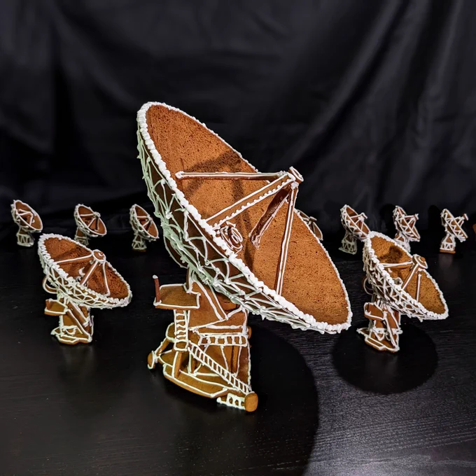 A detailed gingerbread radio dish flanked by smaller ones in the background