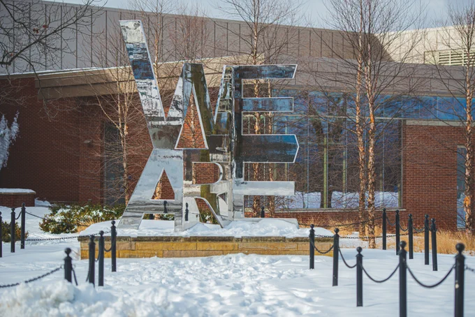 We Are sculpture covered in snow at Penn State University