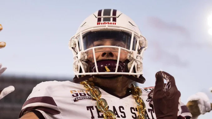 TXST football player celebrates