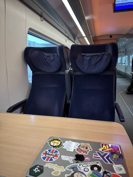 Interior view of the train ICE to Hamburg showing an empty seating group.