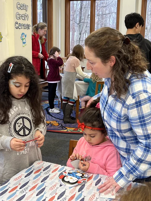 Kids in library doing crafts with librarian