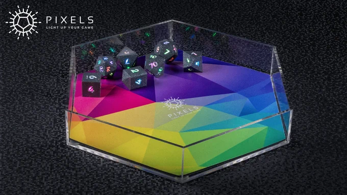 Photograph: RPG set of Hematite Grey dice in a clear acrylic hex-shaped dice tray, the base of the tray lined with a rainbow mat.