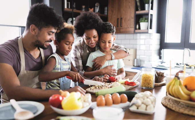 Family making a meal together