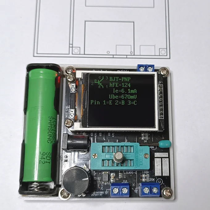 All modules mounted on the plastic base. A small metal tin transistor is placed in the component tester, that is displaying its main characteristics
