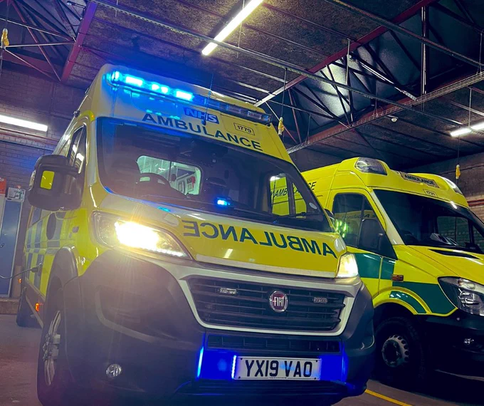 Emergency ambulance with blue lights on