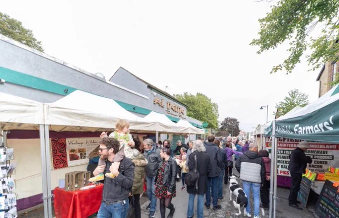 People looking at market stalls