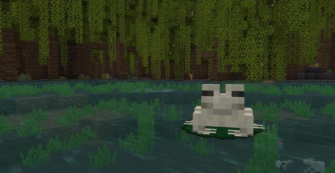 A Minecraft frog sitting on a lily pad in a mangrove swamp.