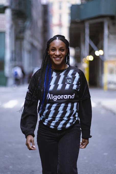 Crystal Dunn smiling in her Gotham FC jersey.