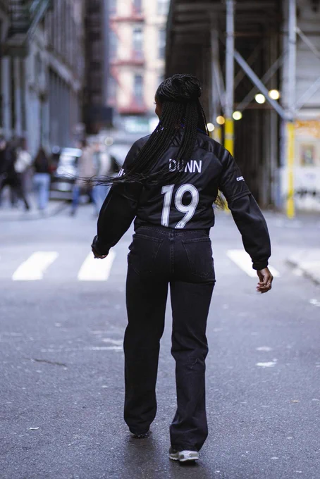 Crystal Dunn showing the back her jersey as it reads “19”